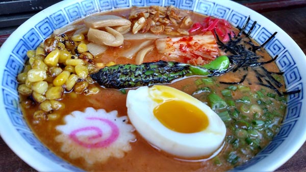 Individuality is the name of the game when it comes to Kuma ramen – diners have their choice of broth, meat, and add-ons including garlic chips, tofu, and spicy kimchi.